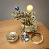 A modern brass orrery, barometer, etc.