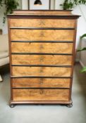 A 19th century continental walnut and ebonised seven drawer chest, 100 cm x 50 cm x 159 cm.