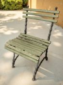 A cast iron framed painted garden chair