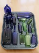 A group of antique glass chemist's bottles, some marked 'Poison, not to be taken', tallest 20 cm.