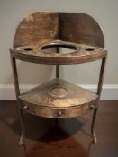 A George III mahogany corner wash stand
