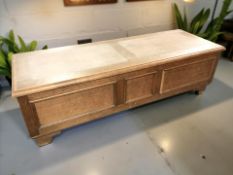 A reproduction oak blanket chest,