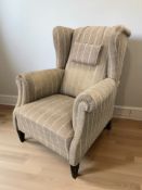 A 20th century wingback armchair, width 86 cm.