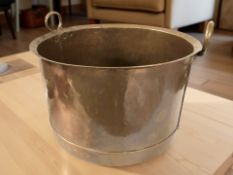 A 19th century copper twin handled pot, diameter 48 cm.