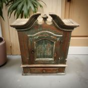 A 19th century Scandinavian painted pine single door wall cabinet,