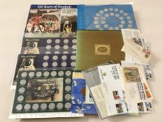 A group of coin sets including historic cars, 1970 World Cup collection,