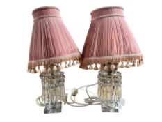 A pair of Victorian crystal lustre table lamps with tasseled shades,