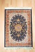 A machine made rug of Iranian design, 126 cm x 76 cm.