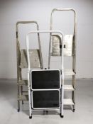 Three folding step ladders