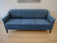 A Scandinavian three seater settee in blue fabric, 181 cm x 78 cm x 79 cm.