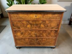 A 19th century figured walnut and ebonised four drawer chest,