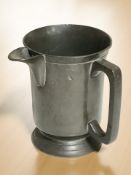 A pewter tankard with spout engraved 'Red Lion Hotel', height 13 cm.