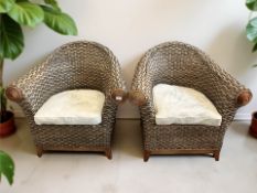 A pair of wicker chairs, width 85 cm.