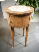 An early 20th century marble inset circular bedside table,