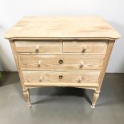 An early 20th century pine four drawer chest,