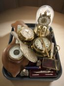 A Kundo brass quartz timepiece under dome,