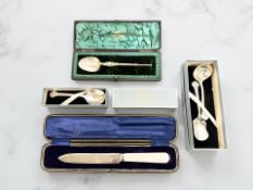 A group of Lindisfarne and other boxed silver