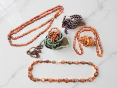 A group of necklaces including ruby, amethyst, jade, jet,