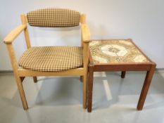A Danish oak armchair, width 60 cm, together with a tile inset lamp table.