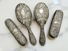 A Victorian silver four-piece dressing table brush set, Goldsmiths & Silversmiths Co, London 1894,