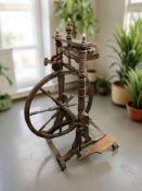 A 19th century beech spinning wheel,