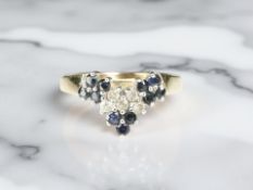 A 9ct gold sapphire and diamond ring, size M½ CONDITION REPORT: 1.