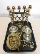 A group of brass and silver plated candlesticks, photo frame, other metal wares.