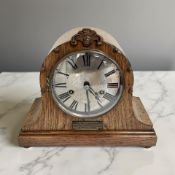 A 1920's oak eight day mantel clock, movement by HAC Wurttemberg, with pendulum and key,