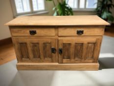 A reproduction pine sideboard,