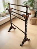 A reproduction mahogany barley twist towel rail, length 72 cm.