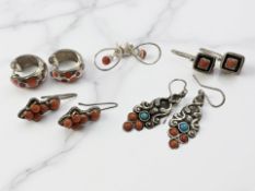 Four pairs of silver and coral earrings and a further enamelled pair