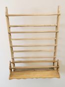 A continental pine wall rack, height 137 cm, and a further oak plate rack.