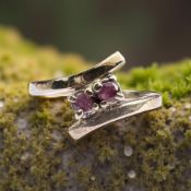 A 9ct gold ruby crossover ring, size I½ CONDITION REPORT: 2.
