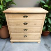 A late 19th century continental pine four drawer chest raised on bun feet,