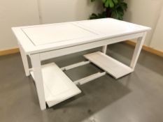 A reproduction continental extending dining table with two pull out leaves,