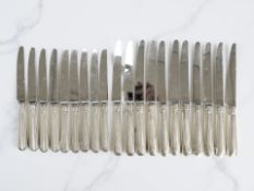 A set of eleven silver-handled table knives and nine matching butter knives, Terry Shaverin,