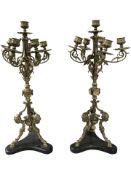 A pair of ornate late 19th century gilt brass six sconce table candelabra,