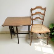 A late Victorian mahogany Sutherland table and three occasional chairs