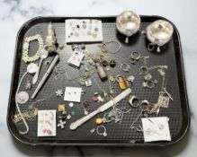 A silver sifter, pair of silver plated salts, gold plated chains, costume jewellery,