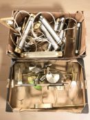 A group of picture lights and other wall lights.