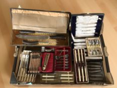 Several canteens of EPNS and stainless steel cutlery, silver teaspoon surmounted by a golfer,