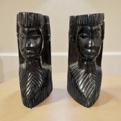 A pair of African carved hardwood figural book ends,