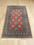 A Lahore Bokhara rug 217 cm x 127 cm