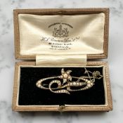 A late Victorian seed pearl brooch, stamped 15ct, width 4.3cm CONDITION REPORT: 5.