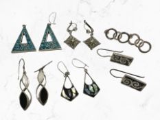 Six pairs of silver/white metal earrings