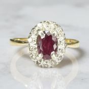 An 18ct yellow gold ruby and diamond cluster ring size M CONDITION REPORT: 2.9g.