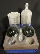 Two green glass floats, three chemist's bottles including one marked poison, a funnel,
