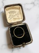 A slim yellow gold band ring, marks illegible CONDITION REPORT: 0.