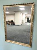 A reproduction gilt and bevelled overmantel mirror 125 cm x 95 cm