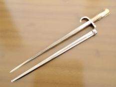 A 19th century French Epee bayonet dated 1878 in scabbard,